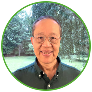 Smiling handsome Asian man in green shirt
