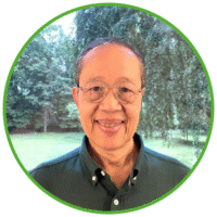 Smiling handsome Asian man in green shirt